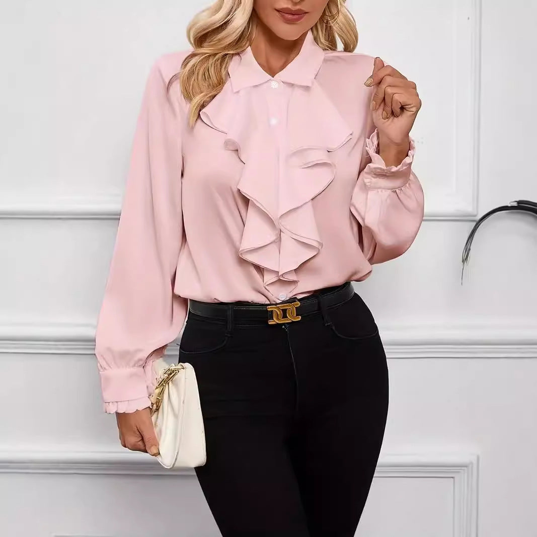 Stylish shirt with ruffled and layered design details.
